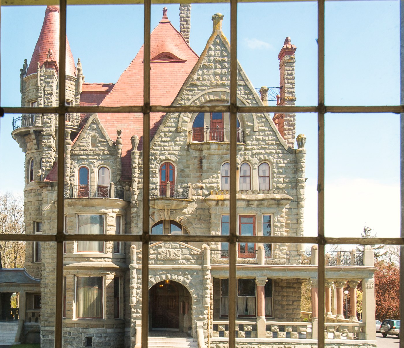 Craigdarroch Castle through the glazing bars of a Craigmyle window